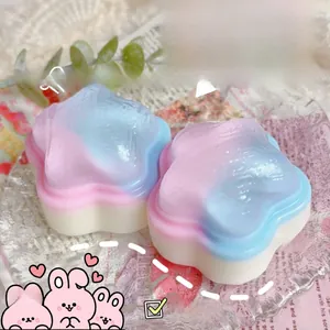 Detail view of two iridescent star-shaped squishy toys with soft gradient colors
