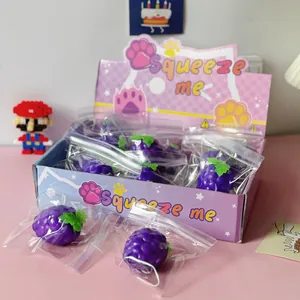 Detailed view of individual purple grape squeeze toys in a cute purple display box