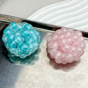 Creative iridescent pearl stress relief squeeze toys in turquoise and pink colors