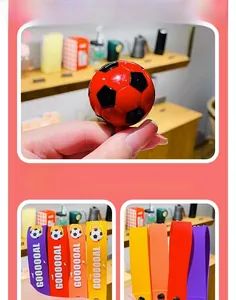 Close-up detail of simulation soccer ball keychain with colorful soft rubber straps