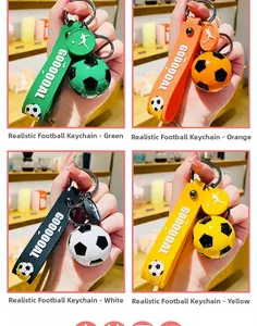 Detailed view of simulation soccer keychains in green, orange, white, and yellow colors.