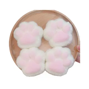 Lot de quatre squishies en peluche patte de chat mignons pour le stress rose blanc