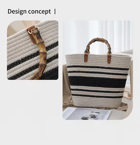 Detalle de un bolso de mano tejido a mano con asa de bambú natural y rayas negras
