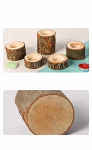 Detailed macro view of natural wood stump texture and rustic wooden candle holders.