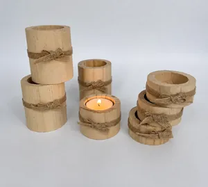 Handcrafted rustic natural wood candle holders and napkin rings with decorative twine bows