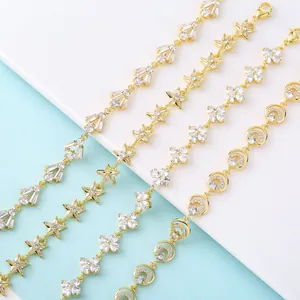 Detailed view of 18K gold plated CZ bracelets with star, flower and moon motifs.