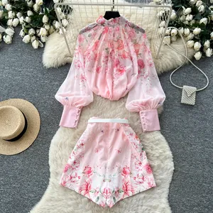 Detailed view of the pink floral palace style lantern sleeve blouse and matching shorts set