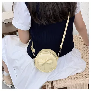Cute yellow mini round crossbody bag for girls with sweet bow decoration