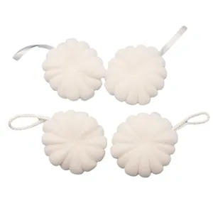 Set of four large white floral bath sponges with hanging ribbons and ropes for exfoliation