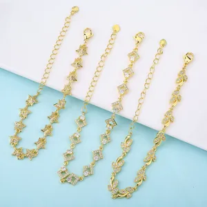Detailed view of micro-pave CZ 18K gold plated bracelets with star and leaf charms