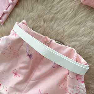 Close-up detail of high-waist floral printed shorts featuring a minimalist white belt