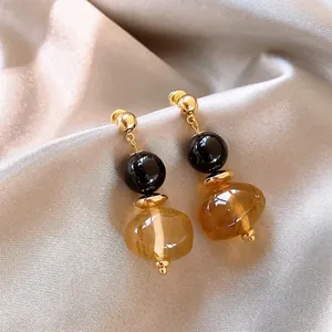 Vintage Maillard style resin earrings with black and amber beads on gold metal