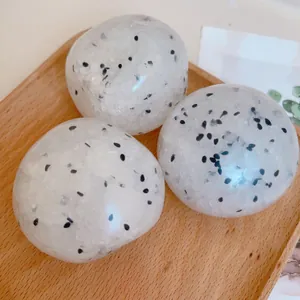 Close-up detail of three translucent dragon fruit patterned squishy stress relief toys