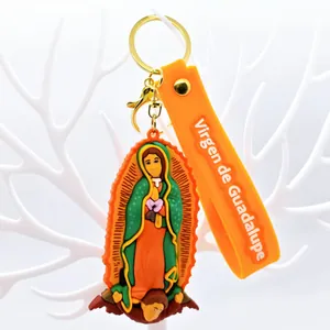 Detailed rubber keychain featuring the Virgin of Guadalupe with a vibrant orange strap.