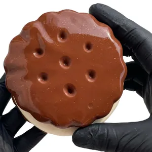 Macro detail of chocolate sandwich cookie squishy toy showing realistic glossy texture
