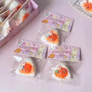 Detail of cute onigiri rice ball squishy toys in individual cartoon packaging.
