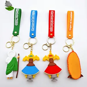Set of colorful rubber religious figure keychains with Spanish text silicone straps.
