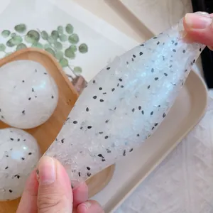 Detail of transparent rice ball squishy toy showing texture and high stretchability