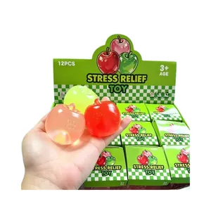 Juguetes antiestrés con forma de manzana translúcida en caja de 12 unidades