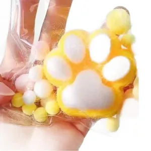 Süßes gelbes und weißes Katzenpfoten-Squishy-Spielzeug zum Stressabbau mit weicher Gelee-Textur