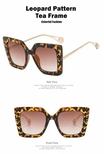 Detailansicht der quadratischen Brille mit Leopardenmuster und Perlendetails.