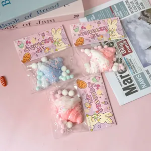 Detailed macro shot of cute packaged croissant squeeze toys with colorful pom-poms