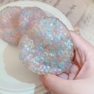 Close-up of a colorful iridescent pearl stress relief squishy toy for relaxation