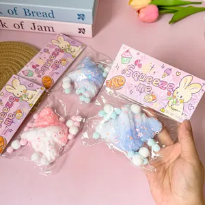 Close-up view of colorful croissant squeeze toys in cute pink rabbit packaging for stress relief