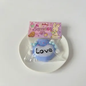Detail of blue heart bear squishy toy in cute Squeeze Me packaging for stress relief