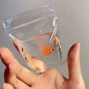 Close-up of a realistic goldfish water bag squishy toy held in hand for stress relief.