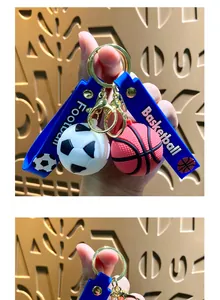 Detailed macro view of 3D sports ball keychains featuring football and basketball charms