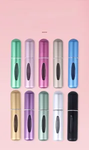 Detail showing ten different colors of matte refillable perfume atomizer bottles