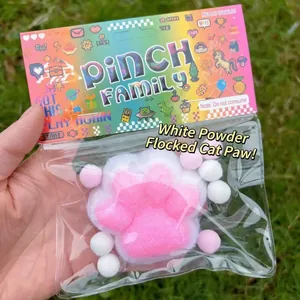 Pink and white flocked cat paw squishy toy for stress relief in original packaging
