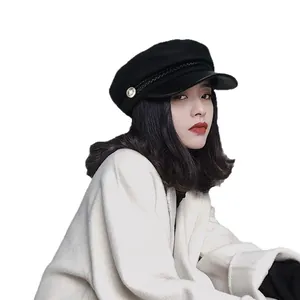 Vintage British style black baker boy hat with leather brim for women shown on model