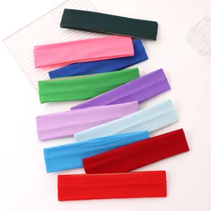 Detailed display of colorful elastic sweat-wicking sports headbands in various vibrant shades