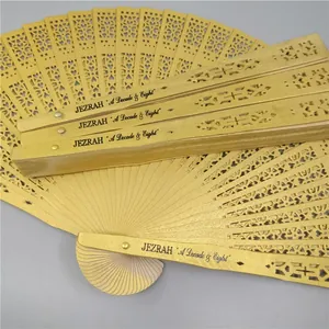 Detailed close-up showing custom engraved text on hollowed wooden folding hand fans
