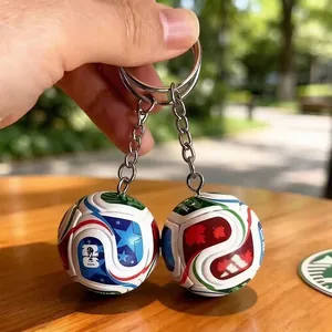 Detailed view showing printed patterns on a 3D soccer ball keychain, 2026 World Cup theme.