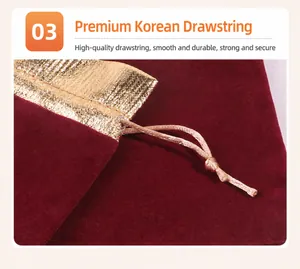 Detailed macro view showing the texture of a burgundy velvet pouch with gold trim.
