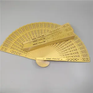 Detail of hollowed-out wooden folding fan with custom printed text on guard