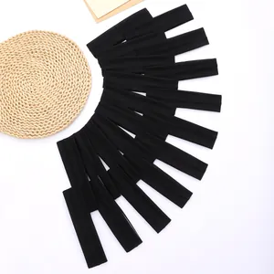 Macro view of several black elastic sports headbands for yoga and fitness exercises.