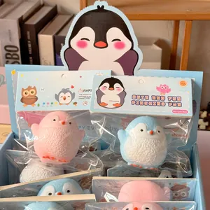 Close-up of pink and blue chubby penguin squishy toys in cute retail gift packaging