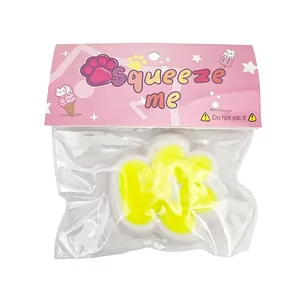 Macro detail of cat paw squishy squeeze toy inside its pink retail header packaging