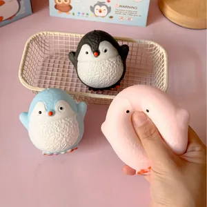Close-up of three cute round penguin squishy toys with a soft slow rebound texture.