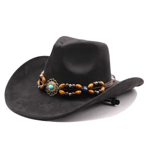 Detailed view of a vintage suede cowboy hat with an ethnic beaded decorative band.