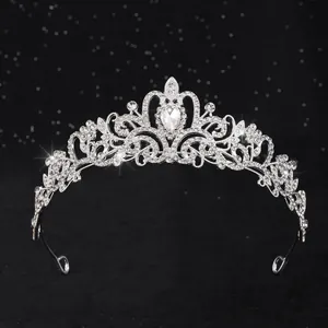 Detailed view of elegant silver bridal crown featuring intricate crystal filigree