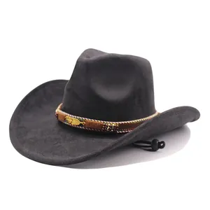 Detail of dark grey suede cowboy hat with decorative gold feather band and chin strap.
