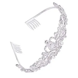 Detail of silver bridal crown with intricate crystal embellishments and side combs