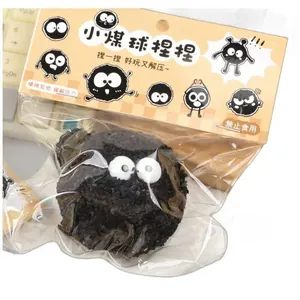 Cute black soot sprite squishy toy in clear plastic packaging for stress relief and fun