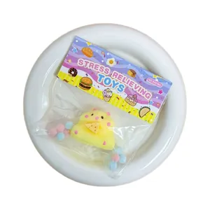 Cute yellow hamster-shaped slow-rebound squishy stress relief toy in product packaging.