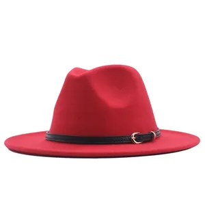 Detailed view of a classic red suede jazz fedora hat with elegant black belt buckle band